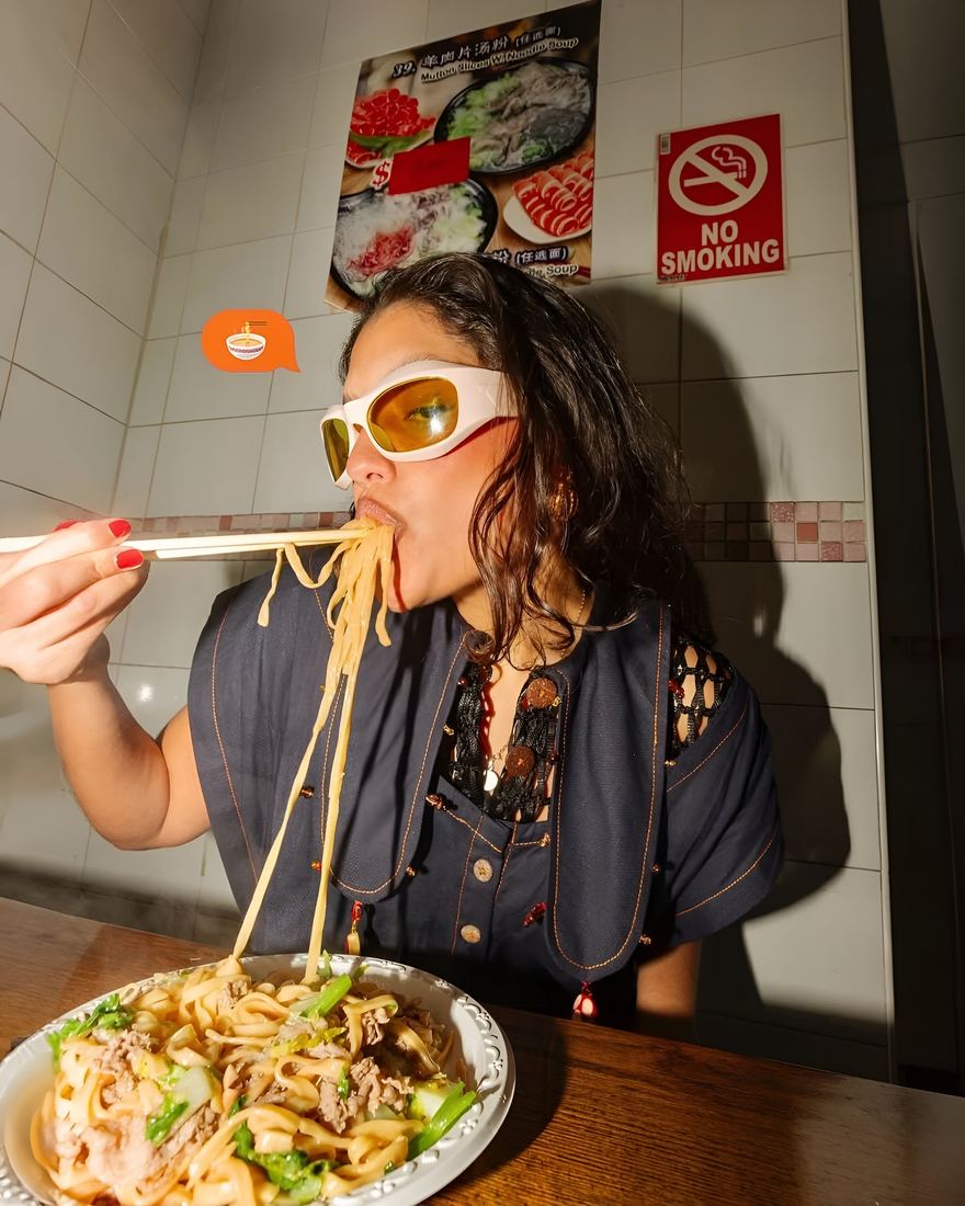 Eating noodles in a tiled late-night noodle bar, on flash